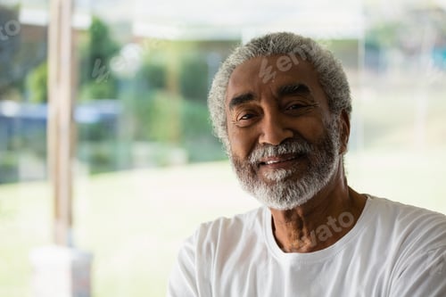 Preview: Smiling senior relaxing at home