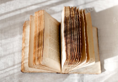 Preview: Open old book with faded pages