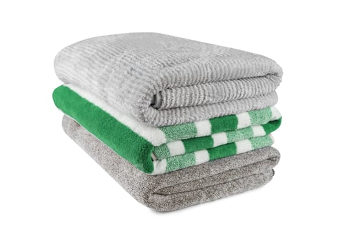 Preview: Soft Fluffy Striped Grey And Green Bath Towels Folded In Stack Isolated On White Background