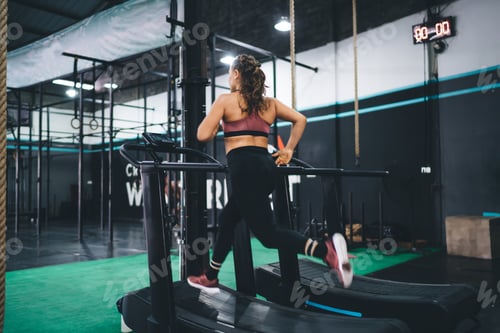 Preview: Woman on Treadmill Working Out in Gym