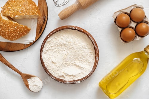 Preview: Preparation for baking. Eggs and flour on white background