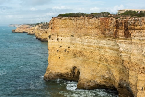 Preview: Cliffs and beach at Algarve coast in Portugal