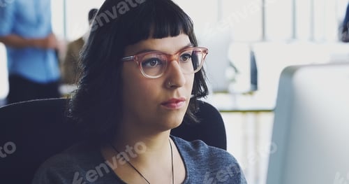 Preview: Cropped shot of an attractive young businesswoman working on her computer in the office