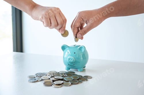 Preview: Image of hands putting coins into piggy bank planning growing saving to strategy with money box for