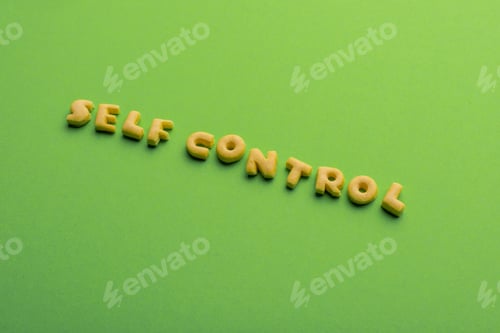 Preview: self controt concept, words made of cookies isolated on green. healthy lifestyle and healthy living