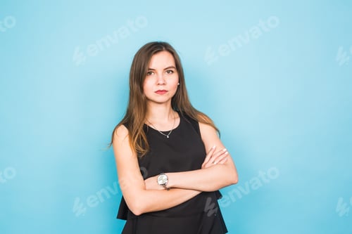 Woman in Black Dress Poses Confidently