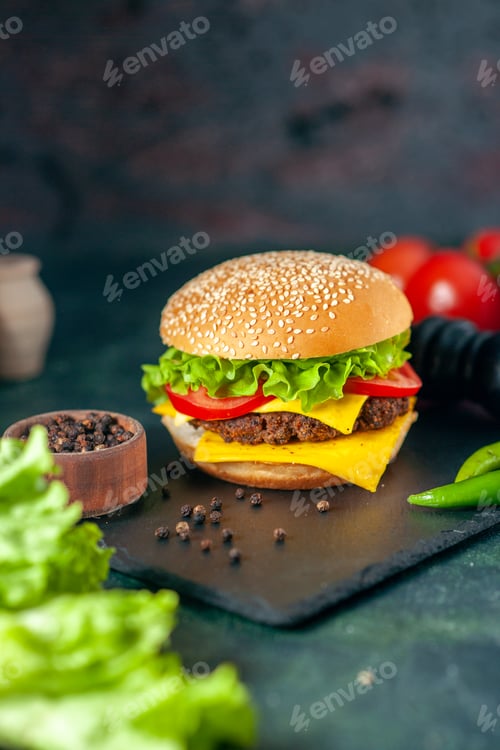 Preview: front view delicious meat hamburger with red tomatoes on dark background color fast-food french