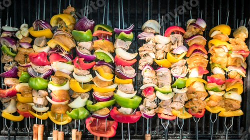 Preview: Chef cooking delicious skewers on the BBQ grill. Cook brochette on grilled meat