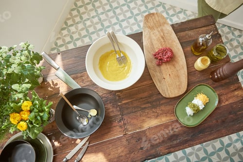 Preview: Various ingredients for preparing steak tartare placed on wooden