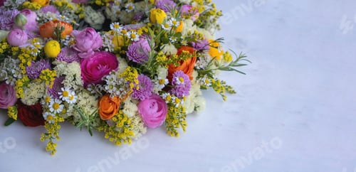 Preview: Fresh flower wreath bouquet decoration on a marble table, close up. Spring, garden nature.