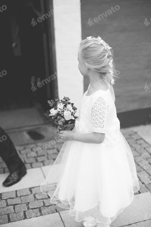 Preview: Grayscale back view of young beautiful flower girl of the wedding