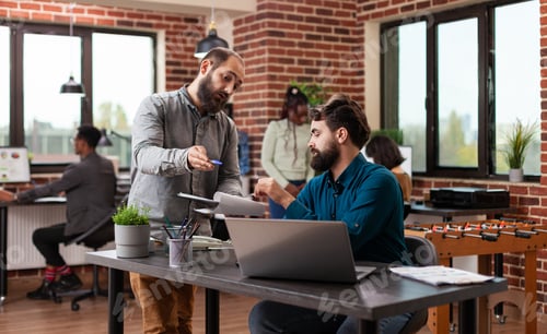 Preview: Millennial entrepreneur men discussing marketing strategy