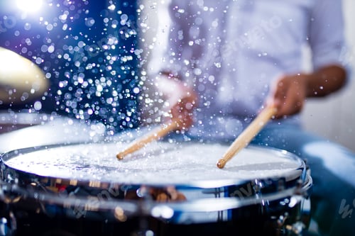 Preview: indian man playing the drums sticks close-up in recording studio