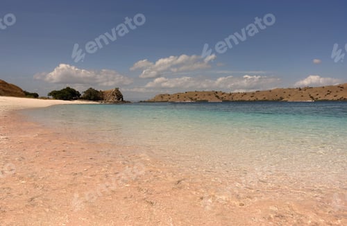 Preview: Tropical pink sand beach in Flores caused by peaces of broken red pink colored coral in the ocean