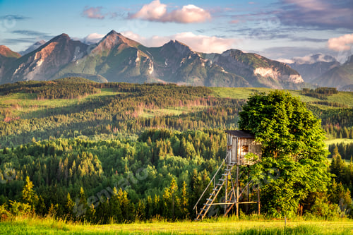Preview: Wooden turret and Tatra mountains at sunset