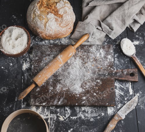 Preview: Baked bread, white wheat flour, wooden rolling pin and old cutting board