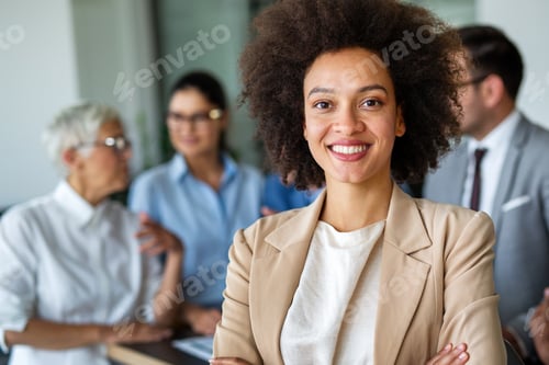 Preview: Portrait of a successful black business woman smiling in corporate office.