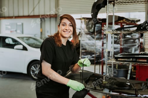 Preview: Happy female car mechanic