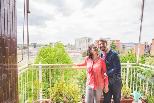 Preview: Couple overs outdoor on terrace smiling