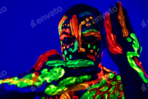Preview: afro american man posing in studio shot with UV light