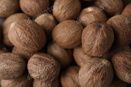 Preview: Many whole nutmegs as background, top view