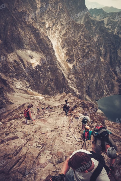 Preview: Hikers climbing on a summit