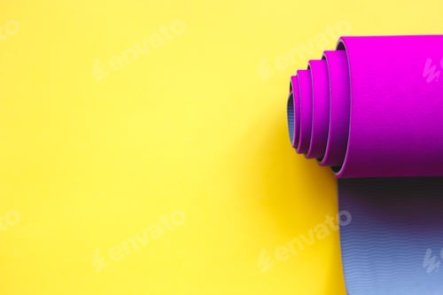 Preview: Bright Yoga Mat on a Yellow Background