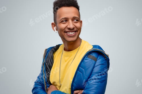 Preview: Smiling African male listening to music