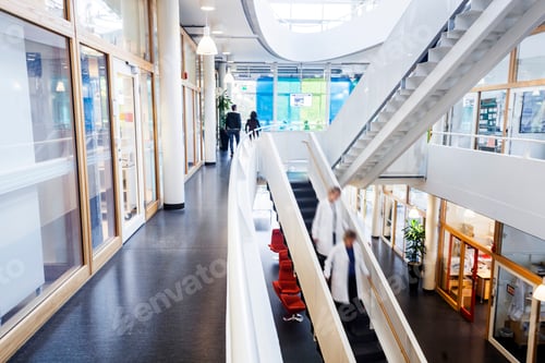 Preview: Doctors moving down steps in hospital