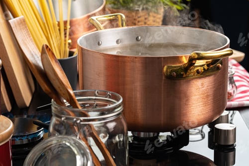 Preview: Copper pot with boiling water on a gas stove