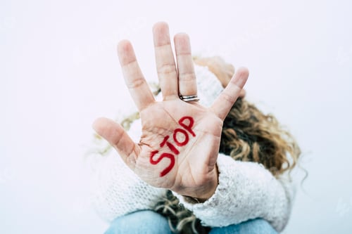 Preview: Women's day concept and stop abuse violence on females people - closeup of hand with stop