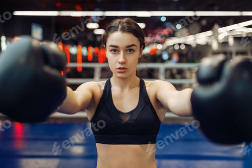Preview: Woman in black boxing gloves, front view