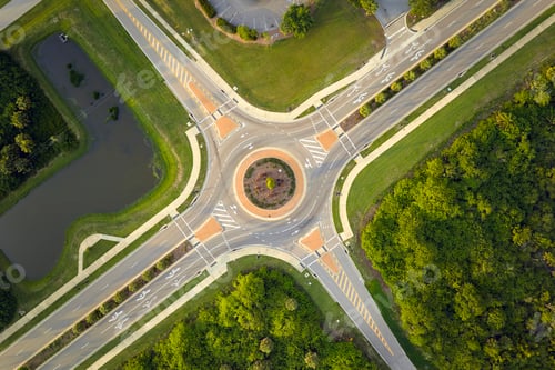 Preview: Aerial view of road roundabout intersection with moving cars traffic.