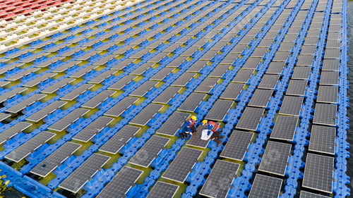 Preview: Floating solar panels providing renewable energy. Aerial view floating on solar cells
