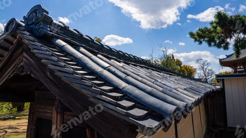 Preview: Beautiful rooftop house at traditional garden under green trees. Roof of Japan