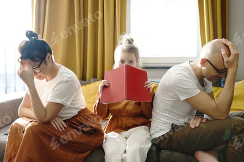 Preview: Tired parents helping her daughter with a homework