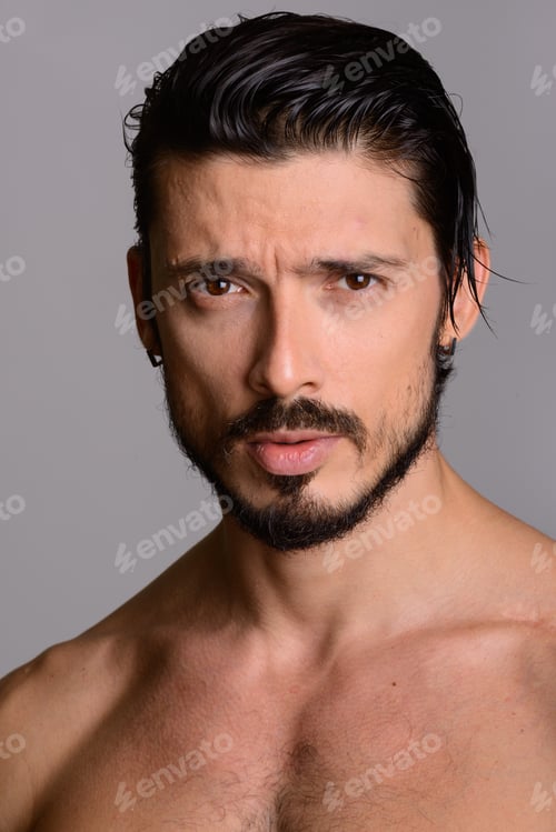 Preview: Face of handsome man shirtless against gray background