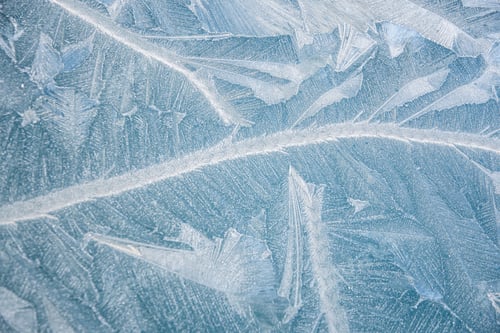 Preview: nature draws frost patterns on the glass with the freezing air temperature