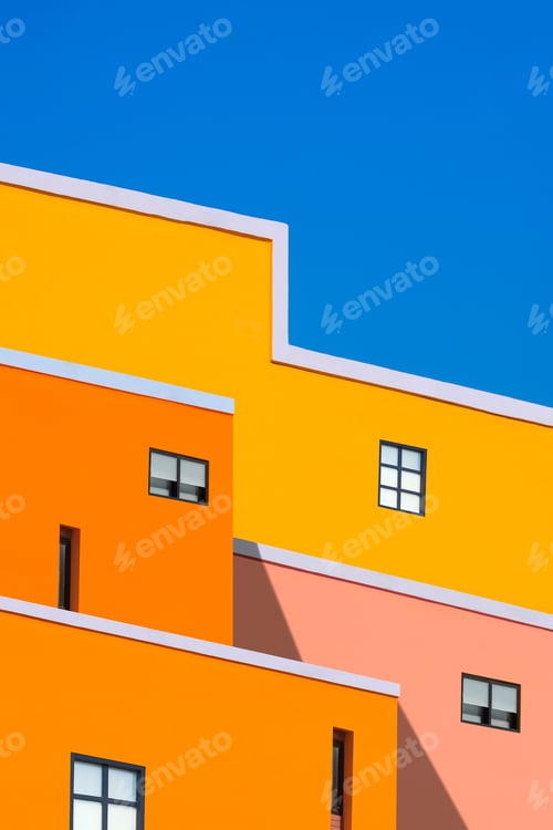 Preview: colorful buildings against blue clear sky in vertical frame, manipulation techniques
