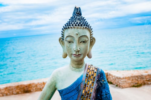 Preview: Sculpture of a meditating yogi in white clay and blue tones with the face of Buddha