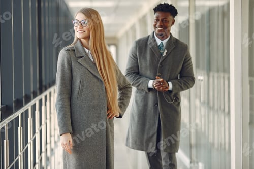 Preview: Businessman with his partner working in a office