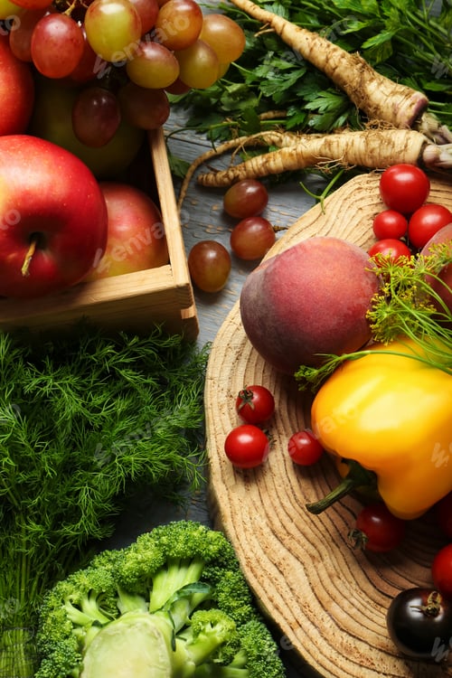 Preview: Different fresh vegetables and fruits on grey wooden table, flat lay. Farmer harvesting