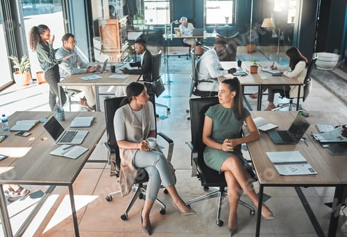 Preview: Open office space policy business people having in formal discussion at their desk in a busy, colla