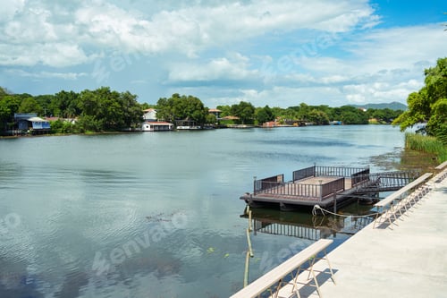 Preview: Scenery of the River Kwai with balcony, pier and lush jungle under blue sky on daylight