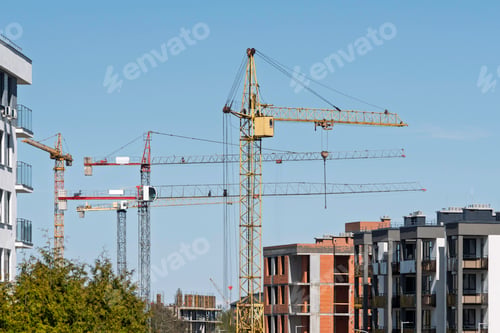 Preview: Urban construction site with multiple tower cranes and unfinished residential buildings