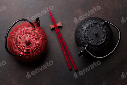 Preview: Red and black tea pots and sushi chopsticks