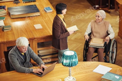 Preview: Diverse Group of People in Library High Angle
