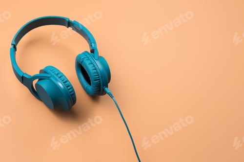 Preview: Photo of stylish modern blue cyan headphones over beige background