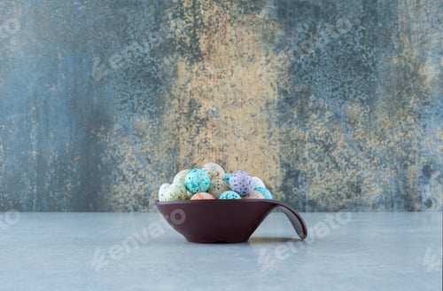 Preview: Colorful stone candies in a black cup