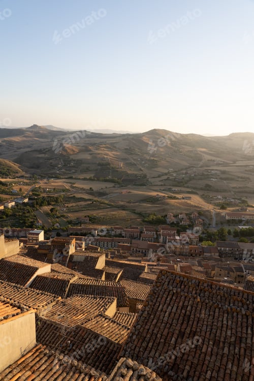 Preview: Terracotta rooftops overlooking rolling hills at sunset
